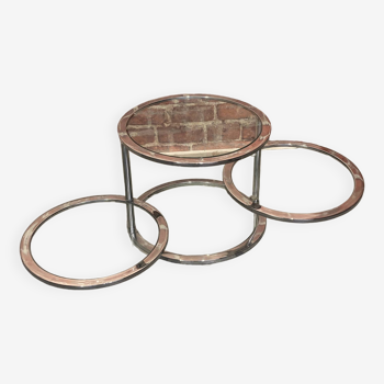 Round coffee table in chrome metal and glass