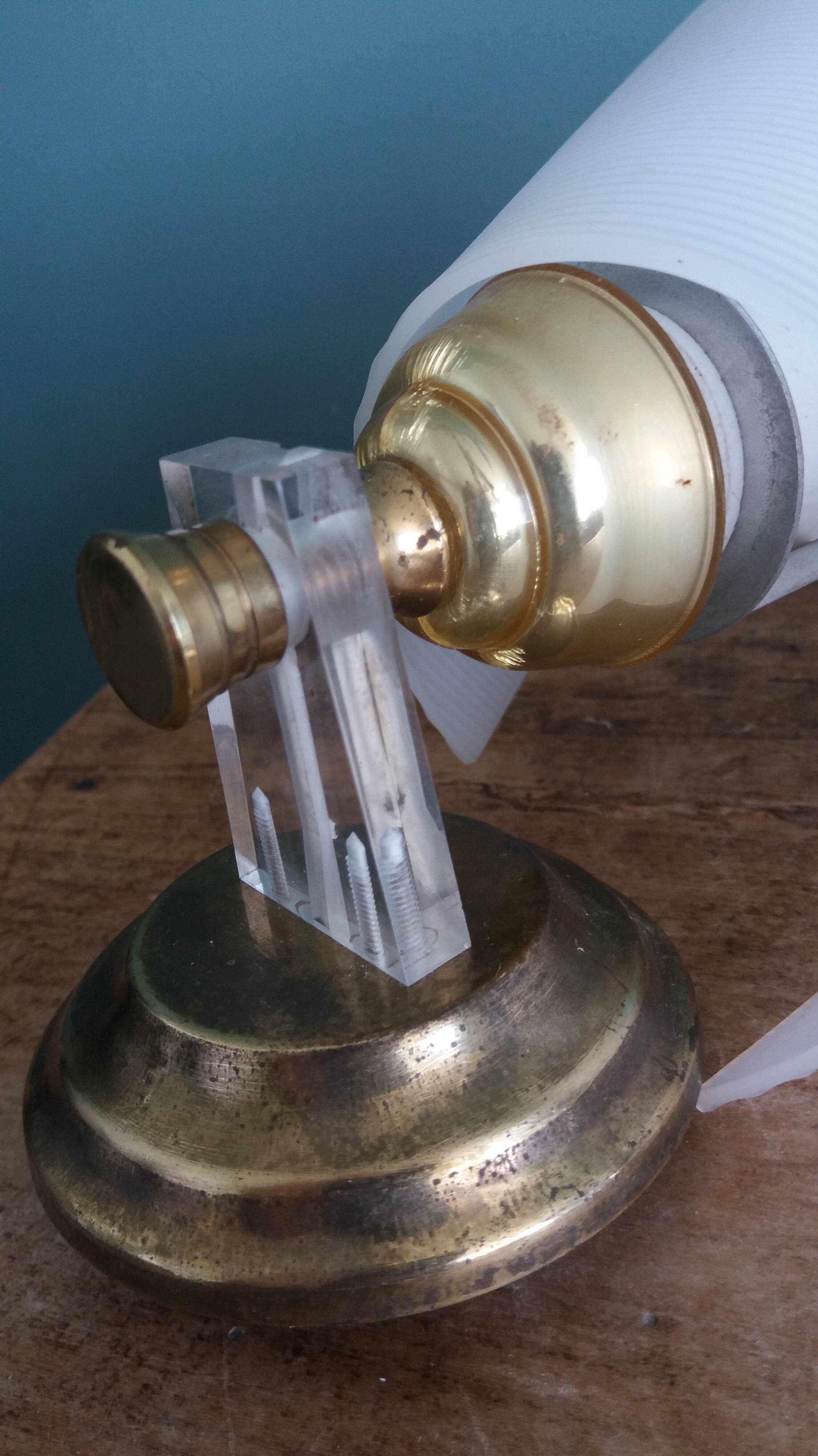 Golden metal appliques and plexiglass perspex in the style of Maison Lunel or Guariche.