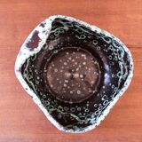 Empty pocket in black ceramic with green drip