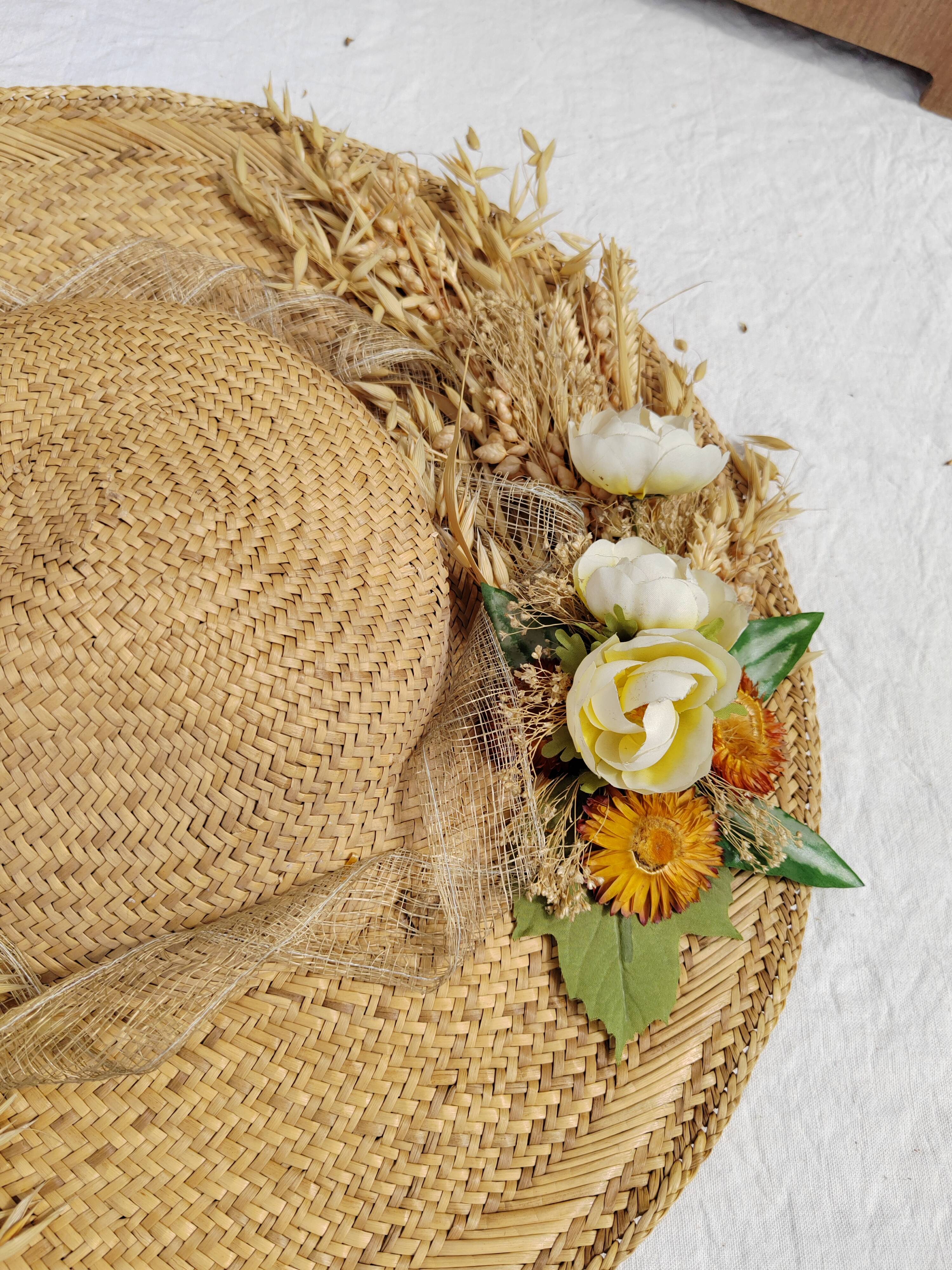 Decorative straw hat with dried flowers