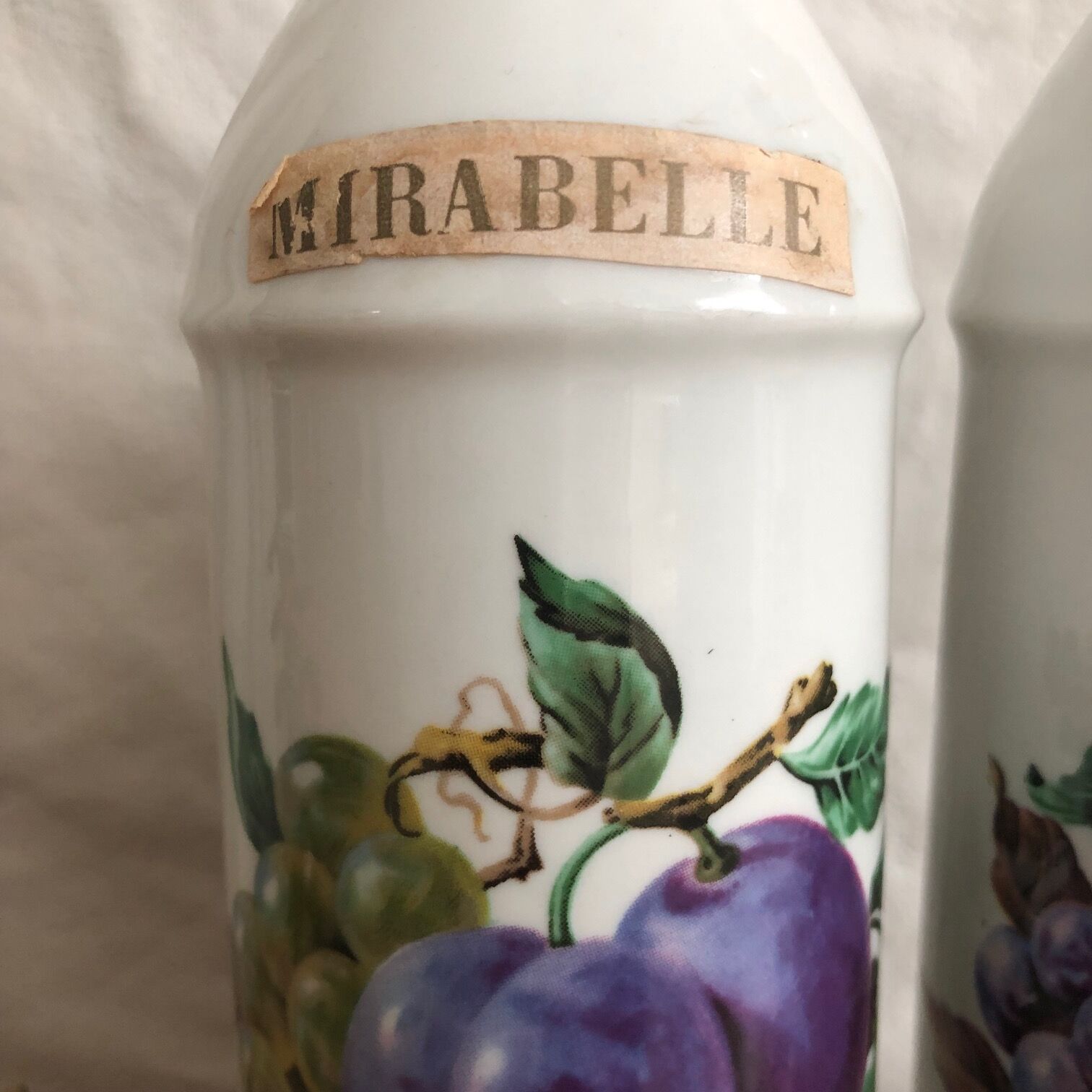 Porcelain bottle duo for mirabelle and raspberry brandy