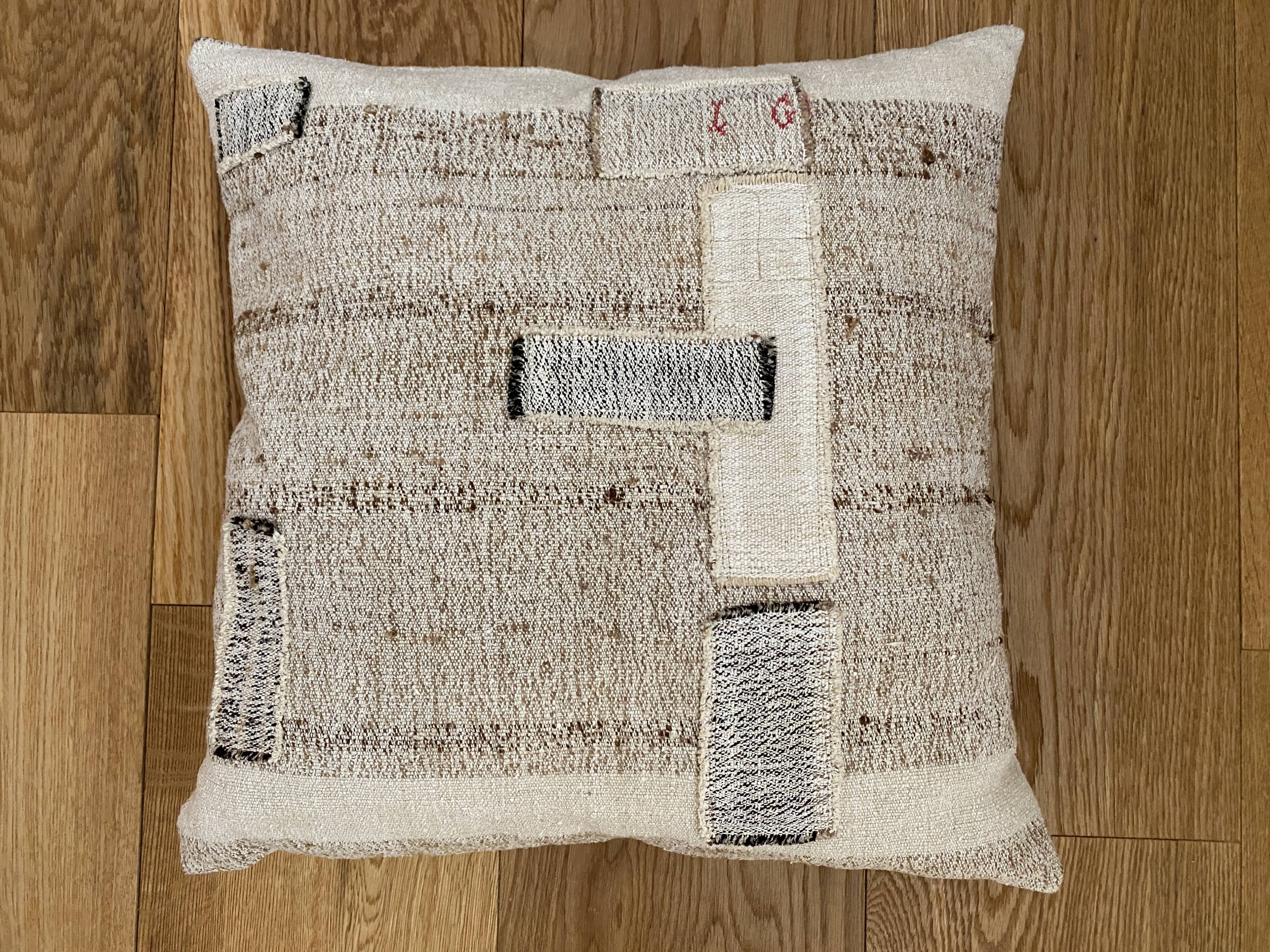 Old canvas cushion woven kilim style, patched
