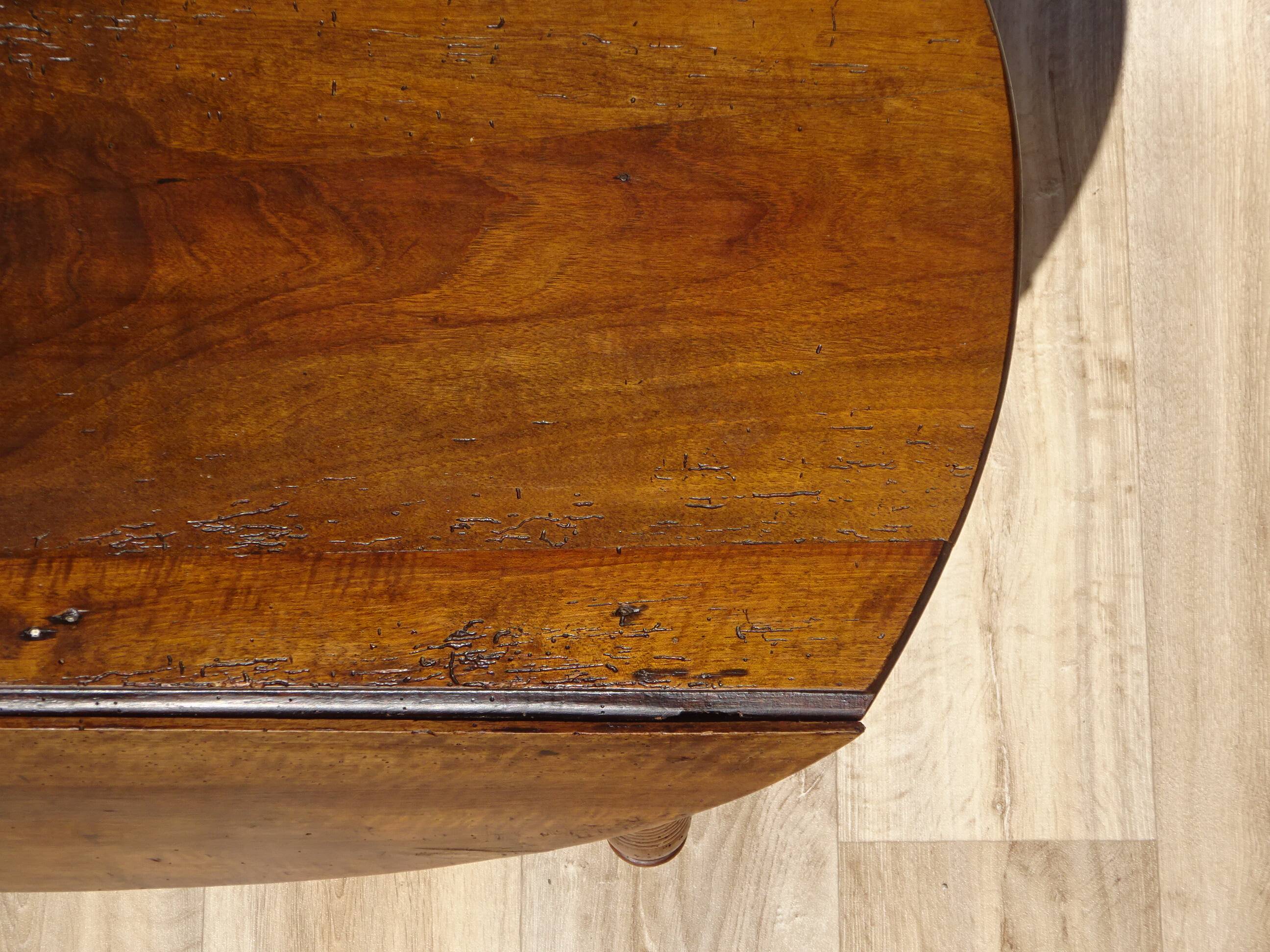 Antique walnut console table with honey spoon legs.
