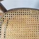 4 mismatched antique bistro chairs in wood and caning