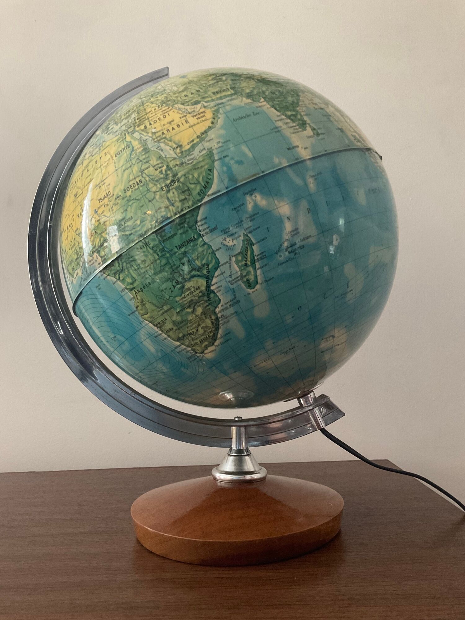Bright vintage world map with wooden foot