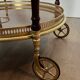 Oval Rolling Table in Brass and Mahogany with Openwork Gallery and Bottle Holder
