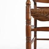 Antique wooden armchair with cane seat, France ca. 1900