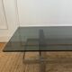 Table basse en acier chromé et plateau en verre fumé design 70