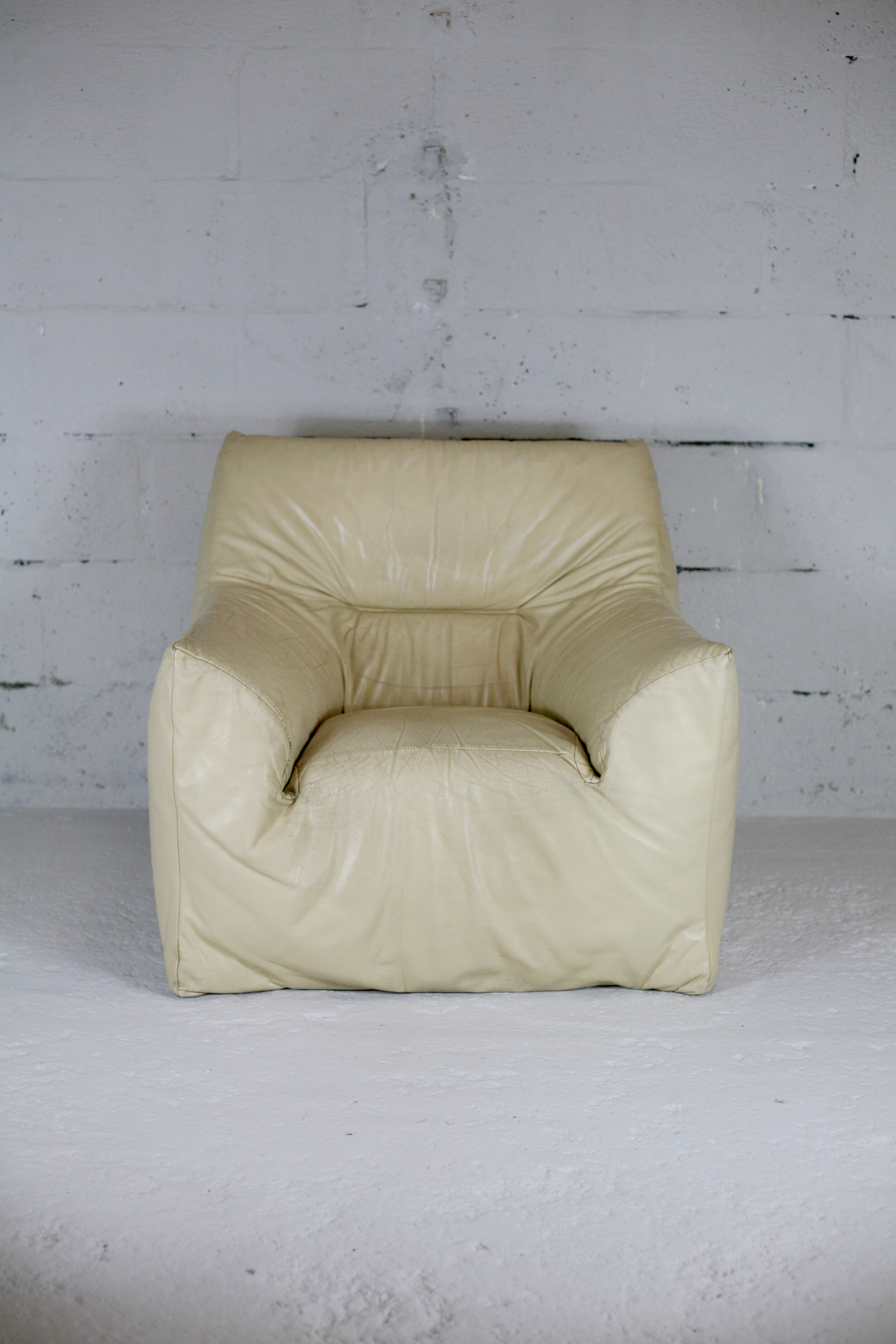Leather armchair and cream-coloured foam, France , circa 1970