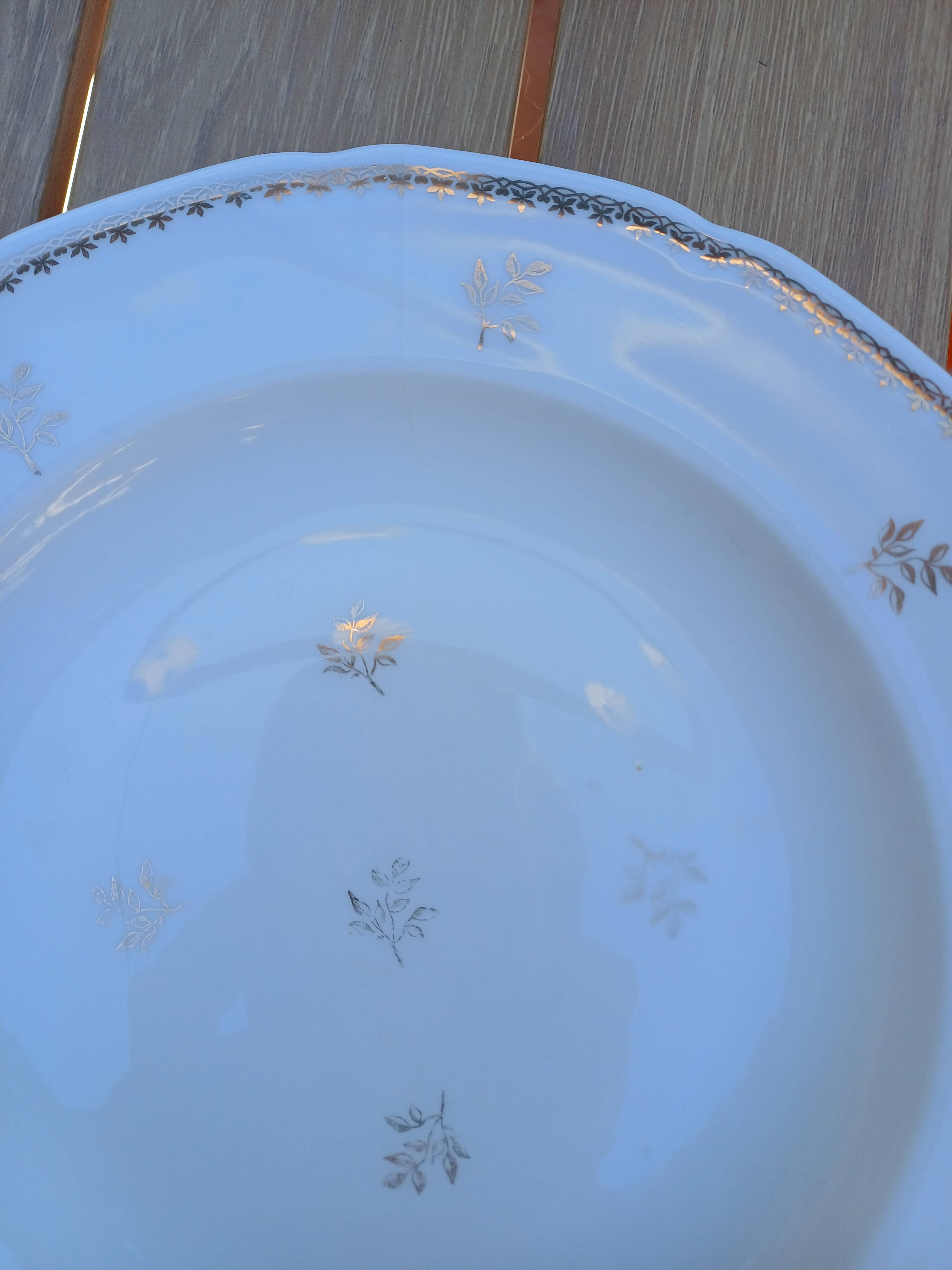 A lot of old white and gold porcelain plates T de F.