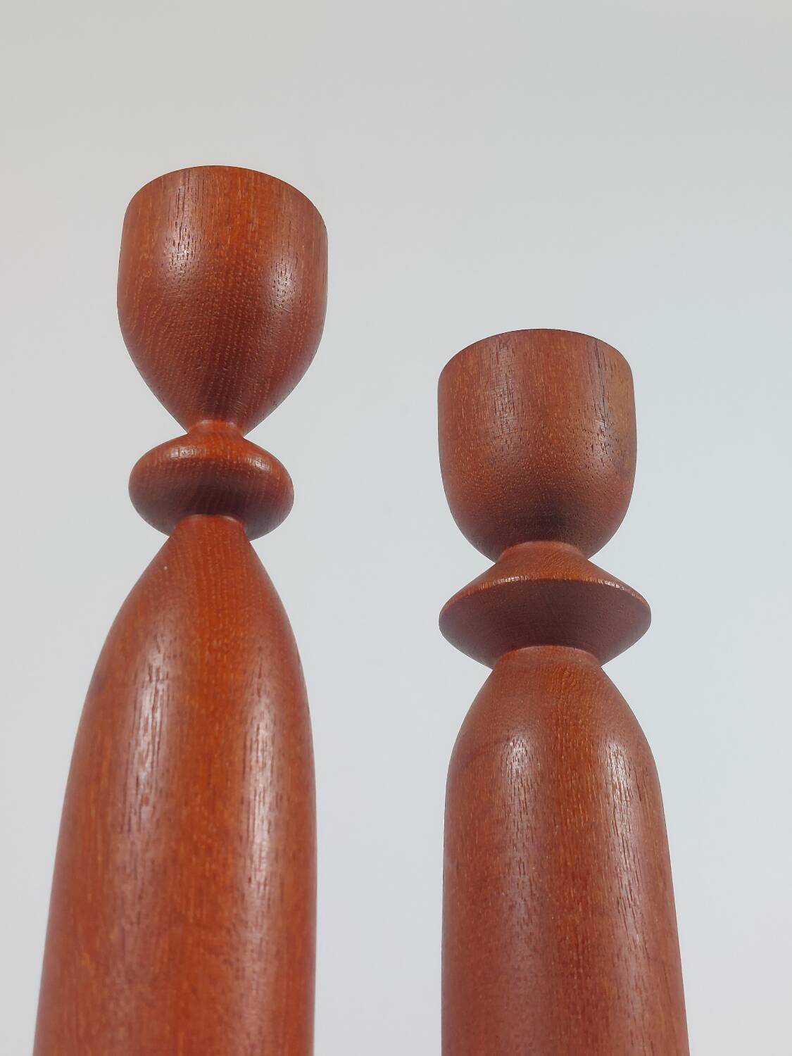 Vintage pair of sculptural teak candlesticks in Scandinavian style.