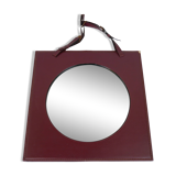 Mirror covered in burgundy leather