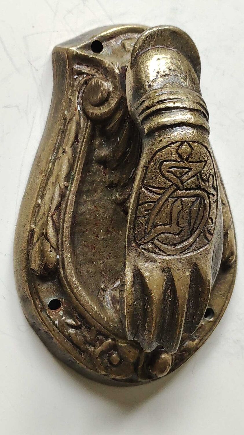 Door knocker in bronze