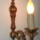 Simple wall sconce in classic Empire style in vintage French bronze.
