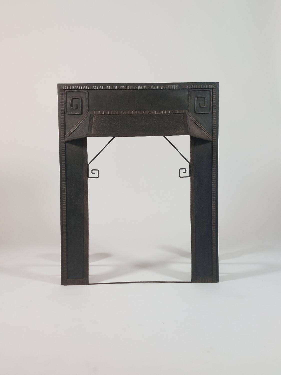 Hand-forged spiral decorative fire surround.