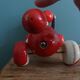 Lacquered wooden pull-along dog toy