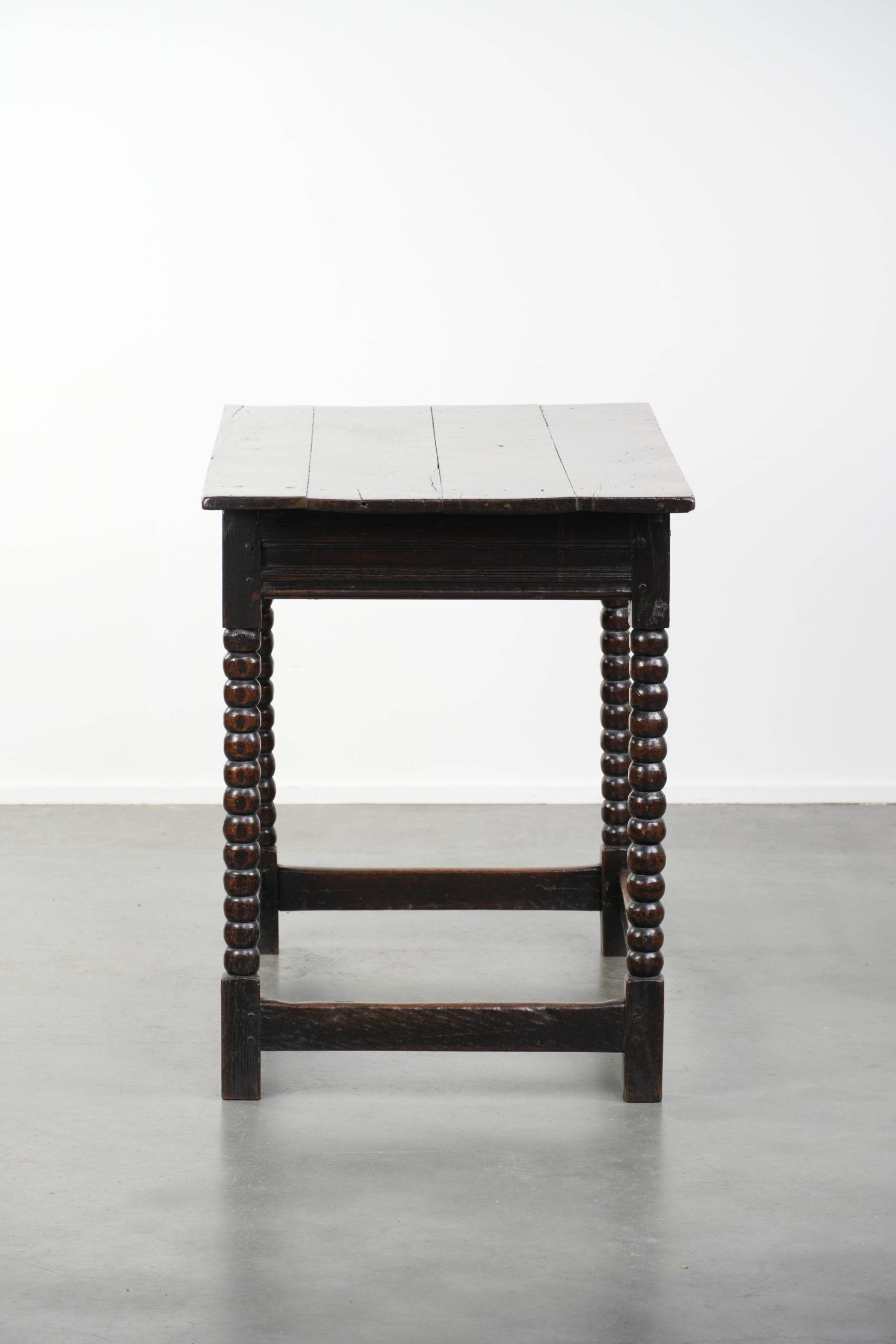 Antique English oak side table from the 18th century with bobbin legs