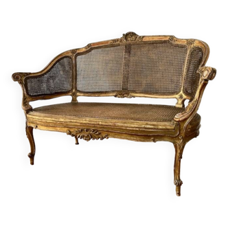 Sofa in gilded wood, cane, 19th century Louis XV style