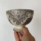 Old bowl made of iron with ceramic seams.
