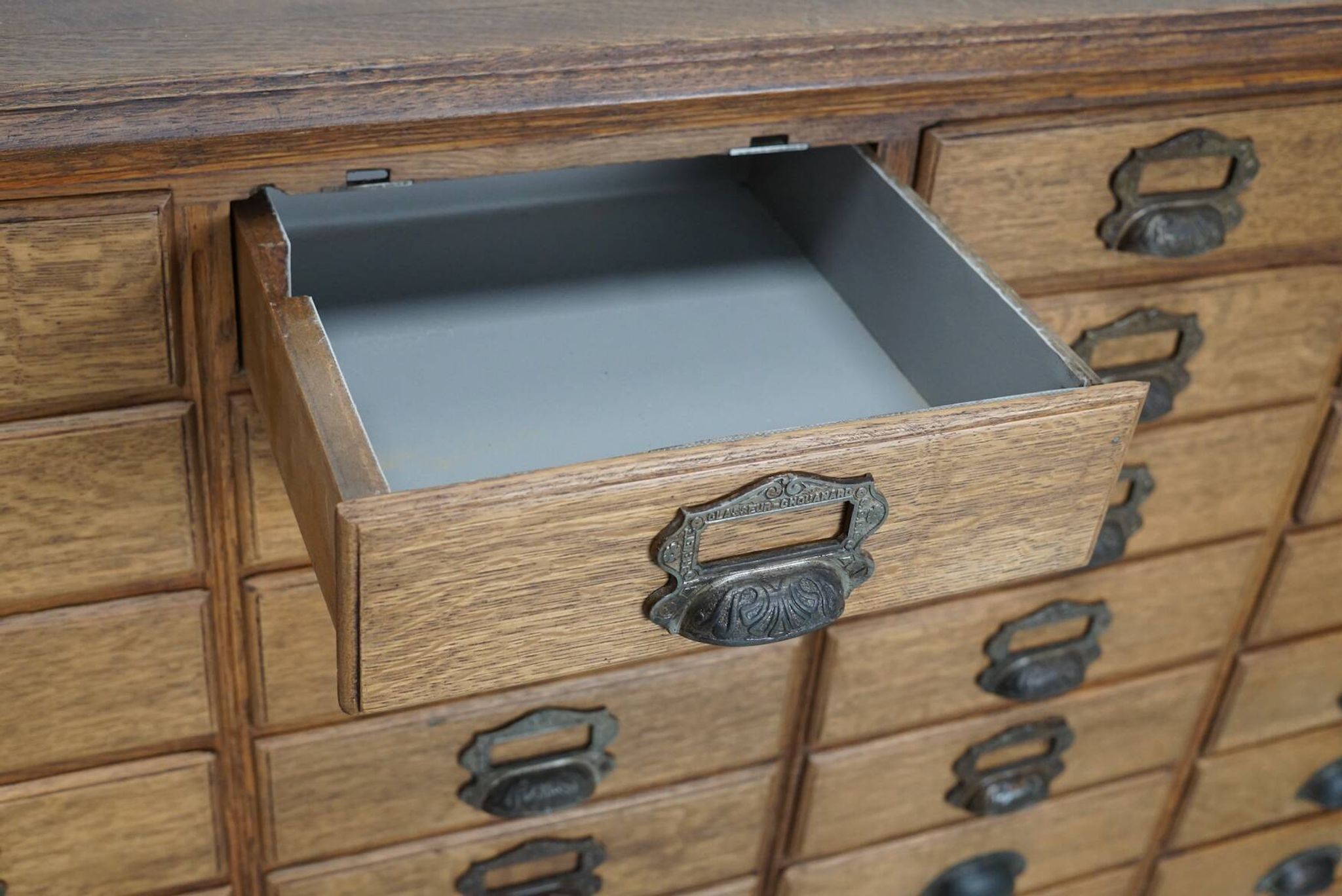 Antique French oak filing / apothecary cabinet by Chouanard, ca 1910