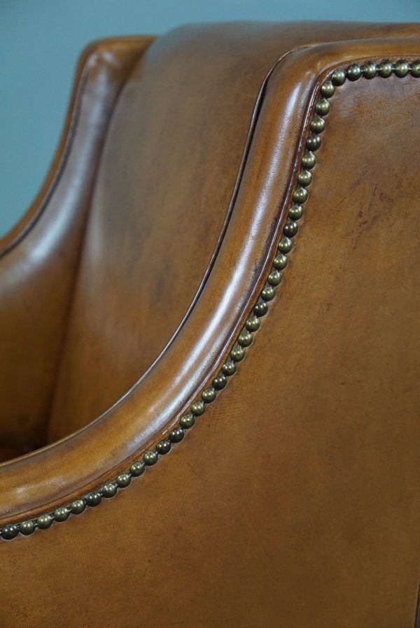 Modern charming armchair in sheepskin