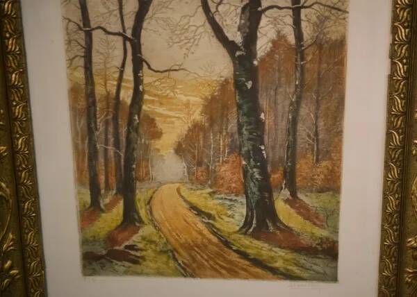 Lithograph of a woodland path, gilt frame, with embossed foliage decoration, 1950s