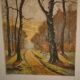 Lithograph of a woodland path, gilt frame, with embossed foliage decoration, 1950s