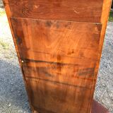 Art Deco sideboard bar cabinet in solid walnut with 3 doors and 1 richly carved tilting false drawer.