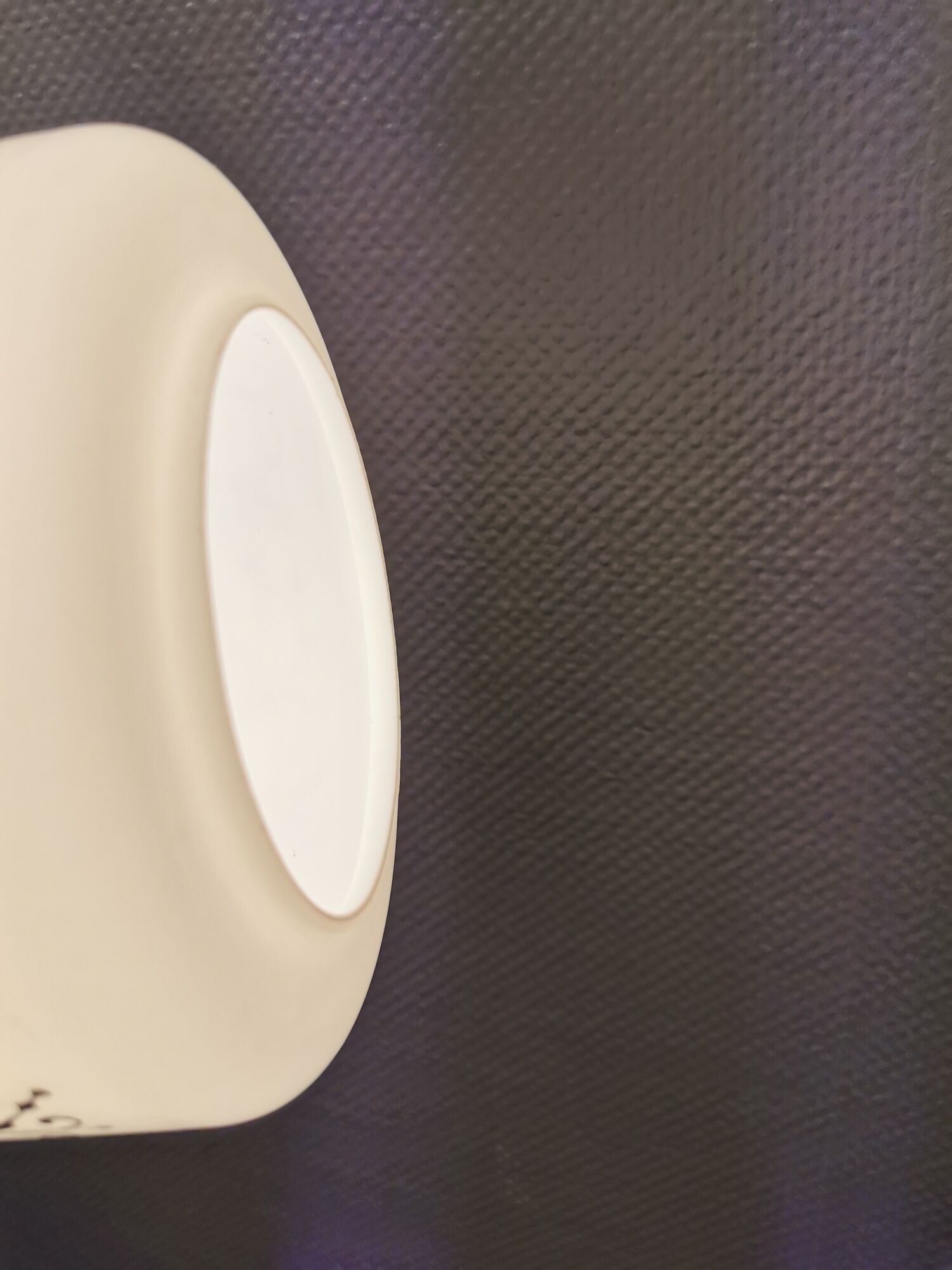 Scandinavian hanging lamp in white glass with inlayed black motifs.