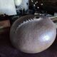 Vintage sandstone vase, in the shape of a rugby ball, signed