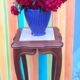 Curved leg wooden stand with a marble top.