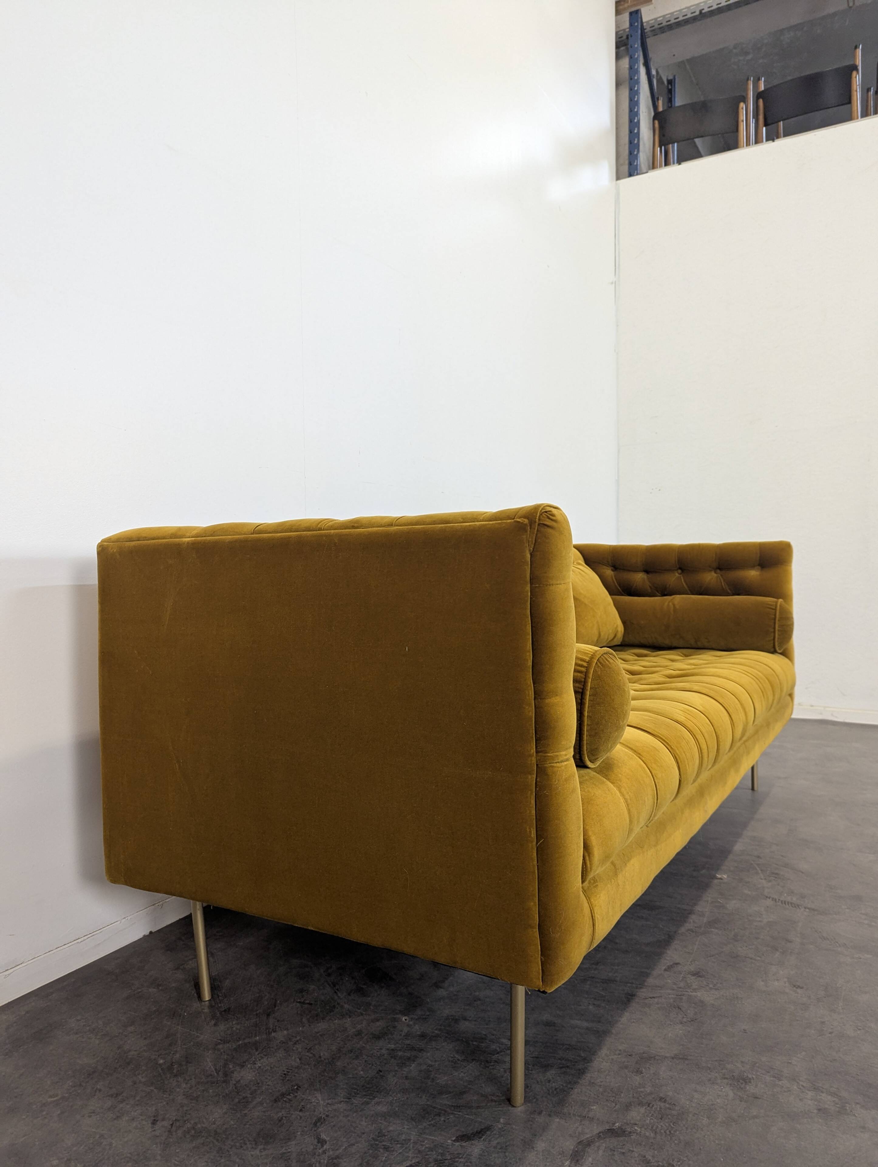 Saffron-colored velvet sofa