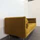 Saffron-colored velvet sofa