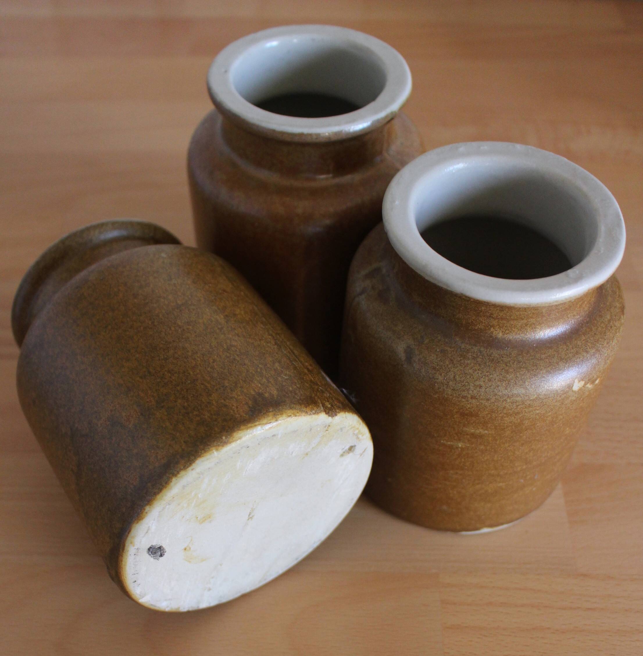 A set of 3 vintage glazed stoneware vases for indoor use.