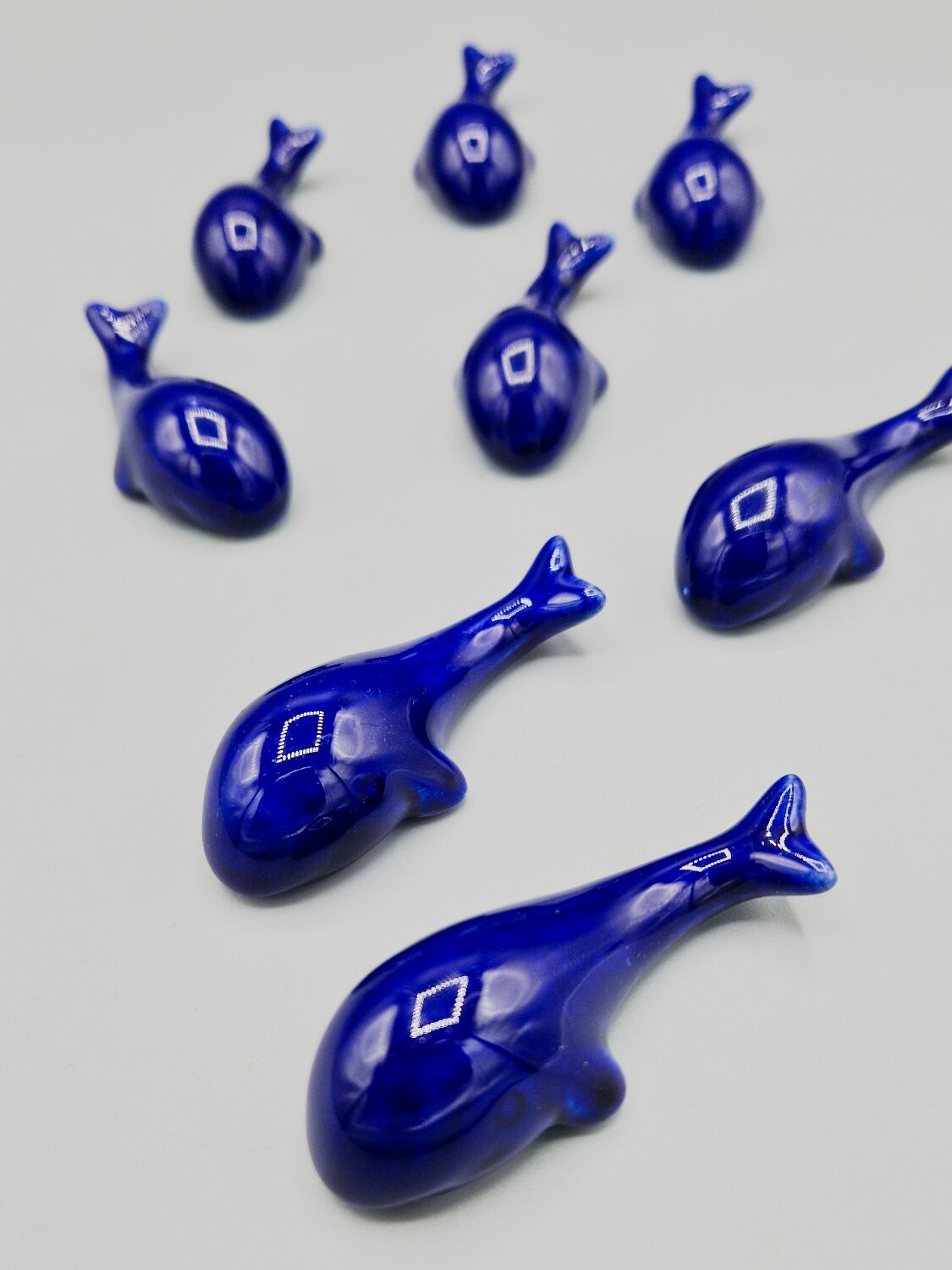 Set of 6 vintage blue porcelain whale knife rests.