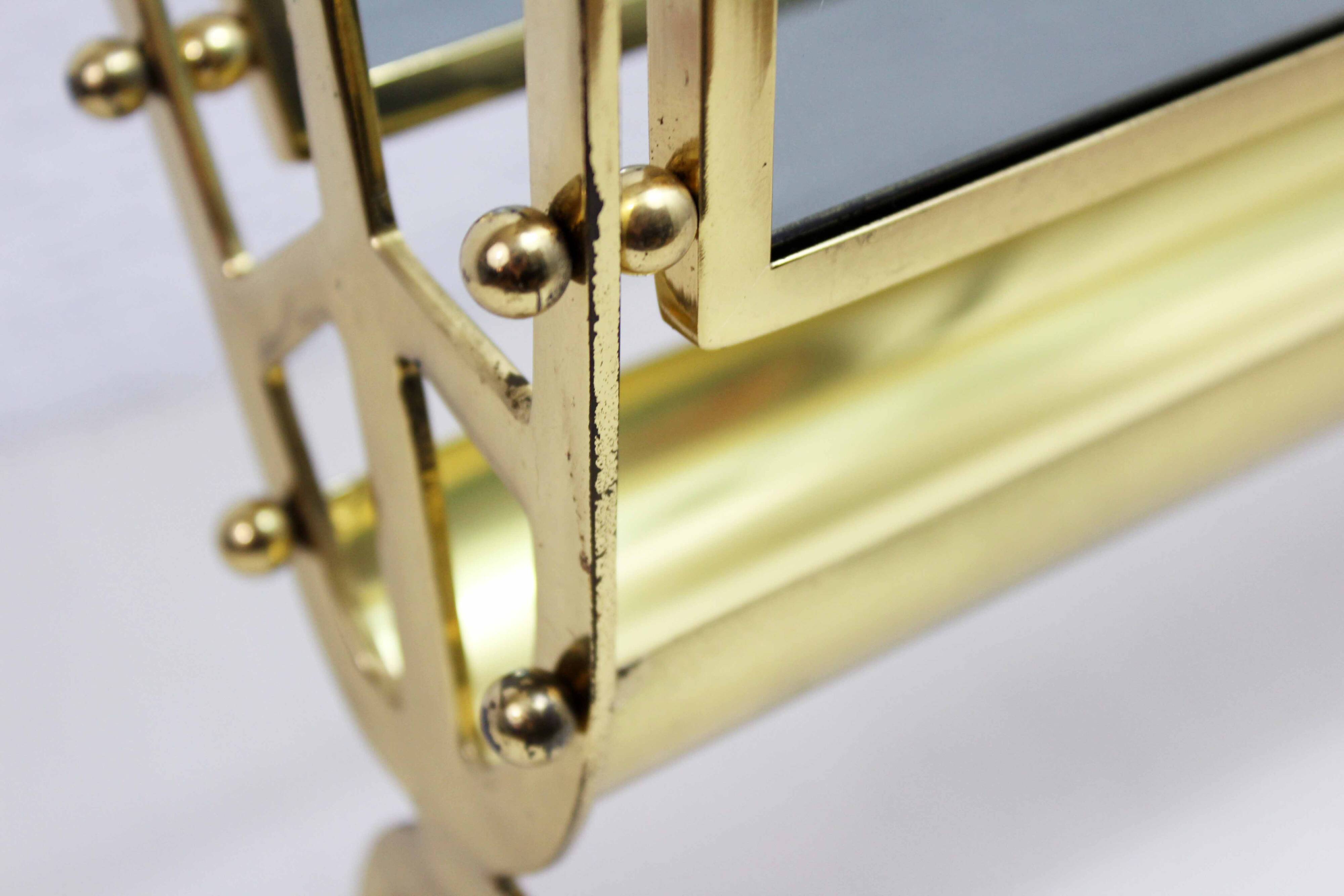 Glass and brass magazine rack, 1970