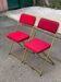 2 folding opera chairs Lafuma France 1970 in gold and burgundy.