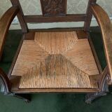 Antique armchair in carved wood and straw seat