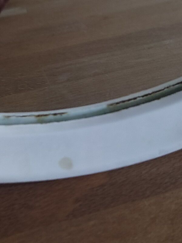 Oval mirror patinated white enamelled metal frame