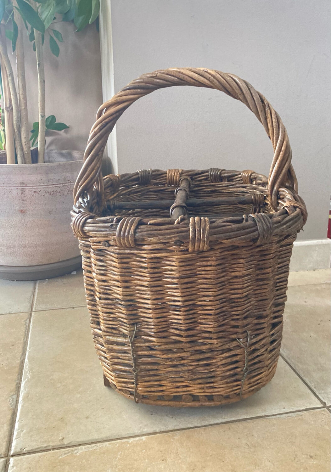 Wicker and hazel bottle basket from the early 20th century or possibly earlier.