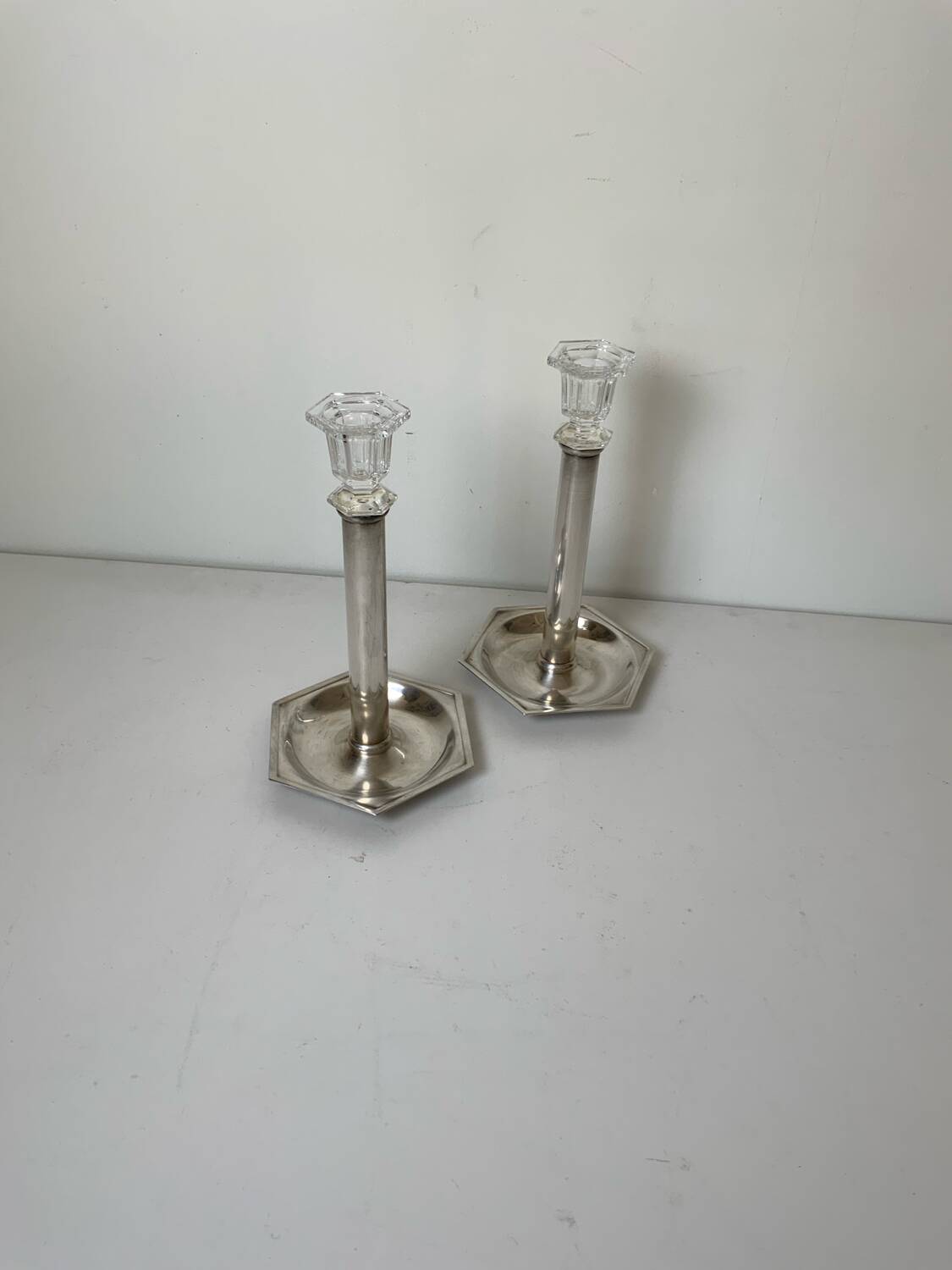 Pair of silver-plated metal candlesticks