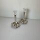 Pair of silver-plated metal candlesticks