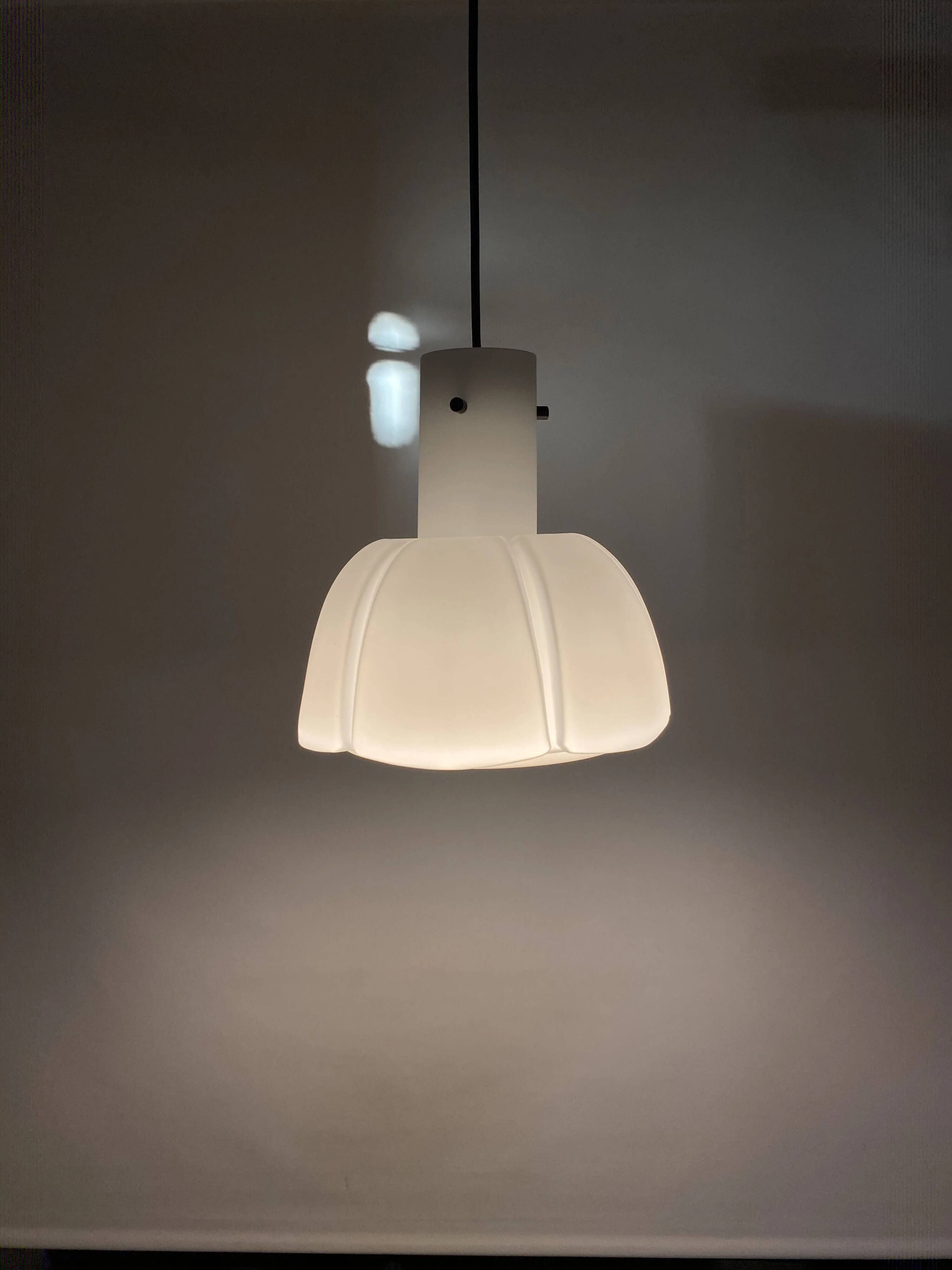 Frosted glass pendant in the shape of a white flower by Glashütte Limburg.