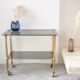 Gold metal and smoked glass server