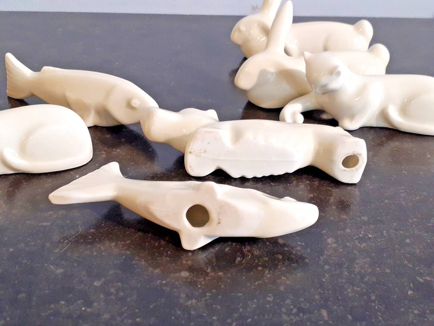 Set of 7 porcelain knife rests, animals, dog, cats, fish, rabbit.