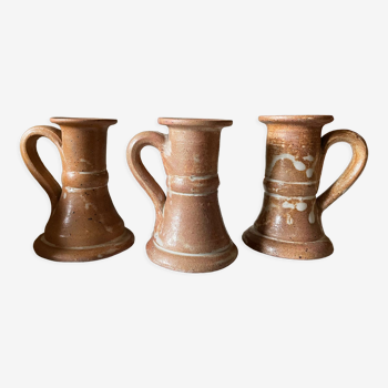 Trio of stoneware candle holders