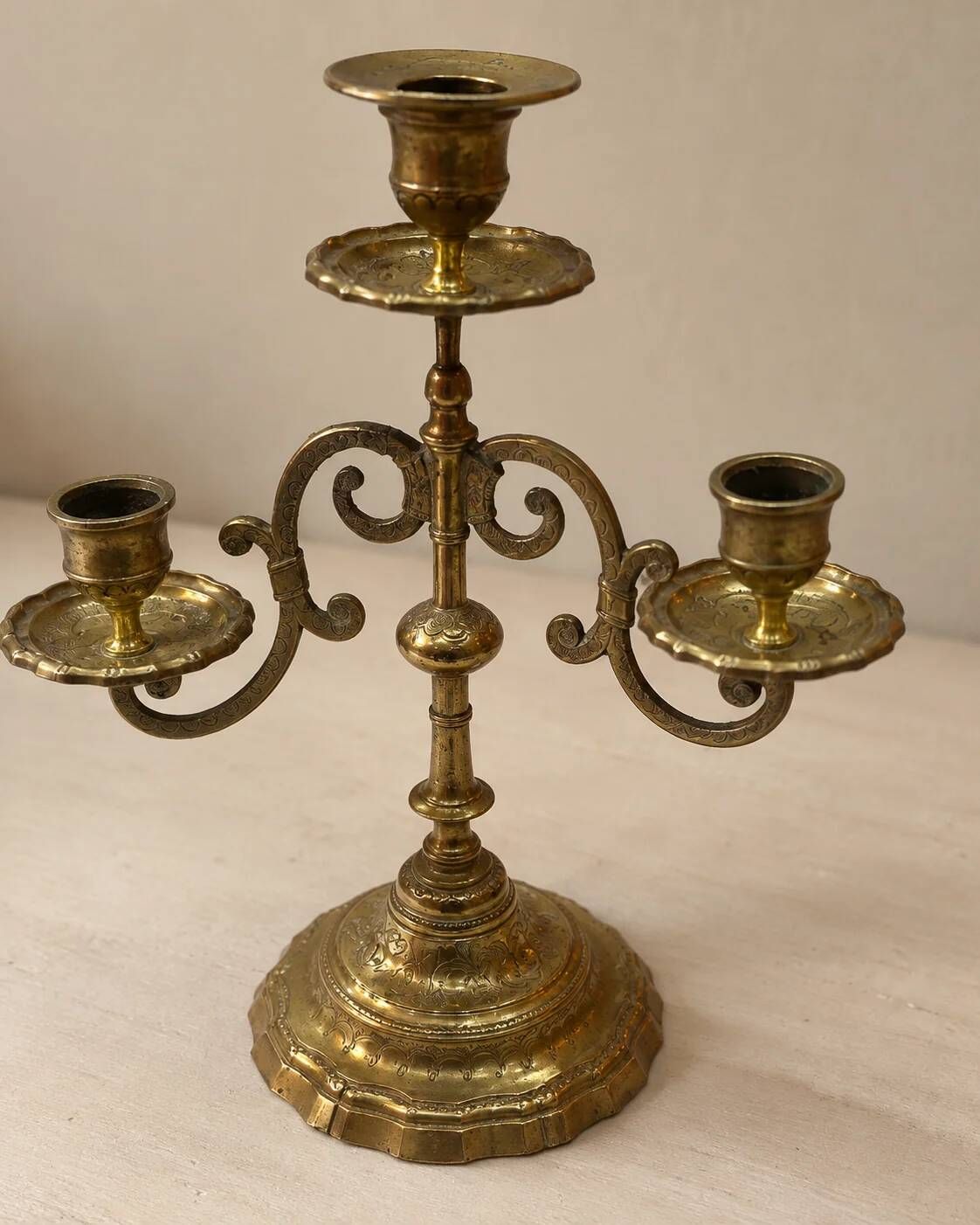 Three-light candelabrum in engraved brass — France, circa 1900
