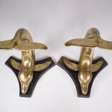 Solid brass dolphin console feet.