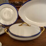 Limoges porcelain table service with blue band on white and gold background