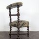 Napoleon III smoking chair in twisted blackened wood with foliage upholstery.